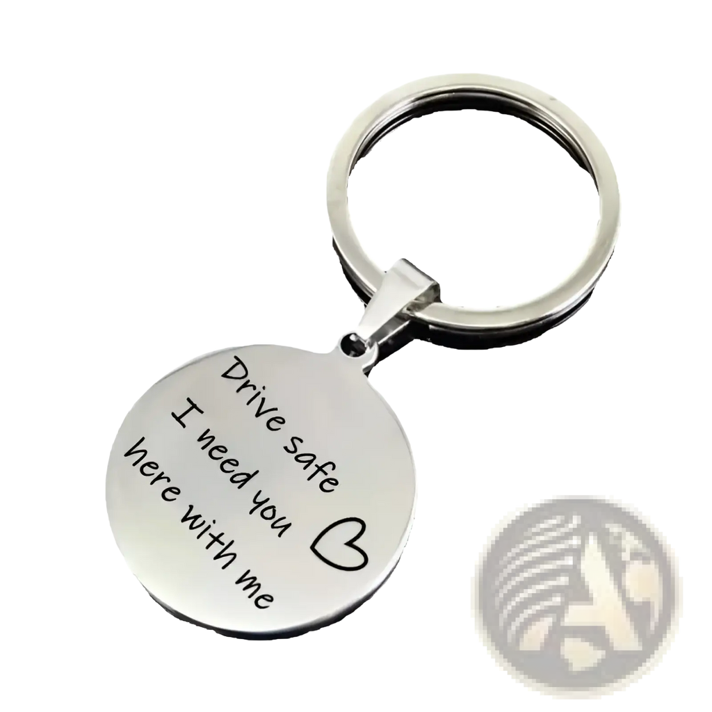 Silver circular sterling silver drive safe engraved keychain with message drive safe i need you here with me and heart symbol