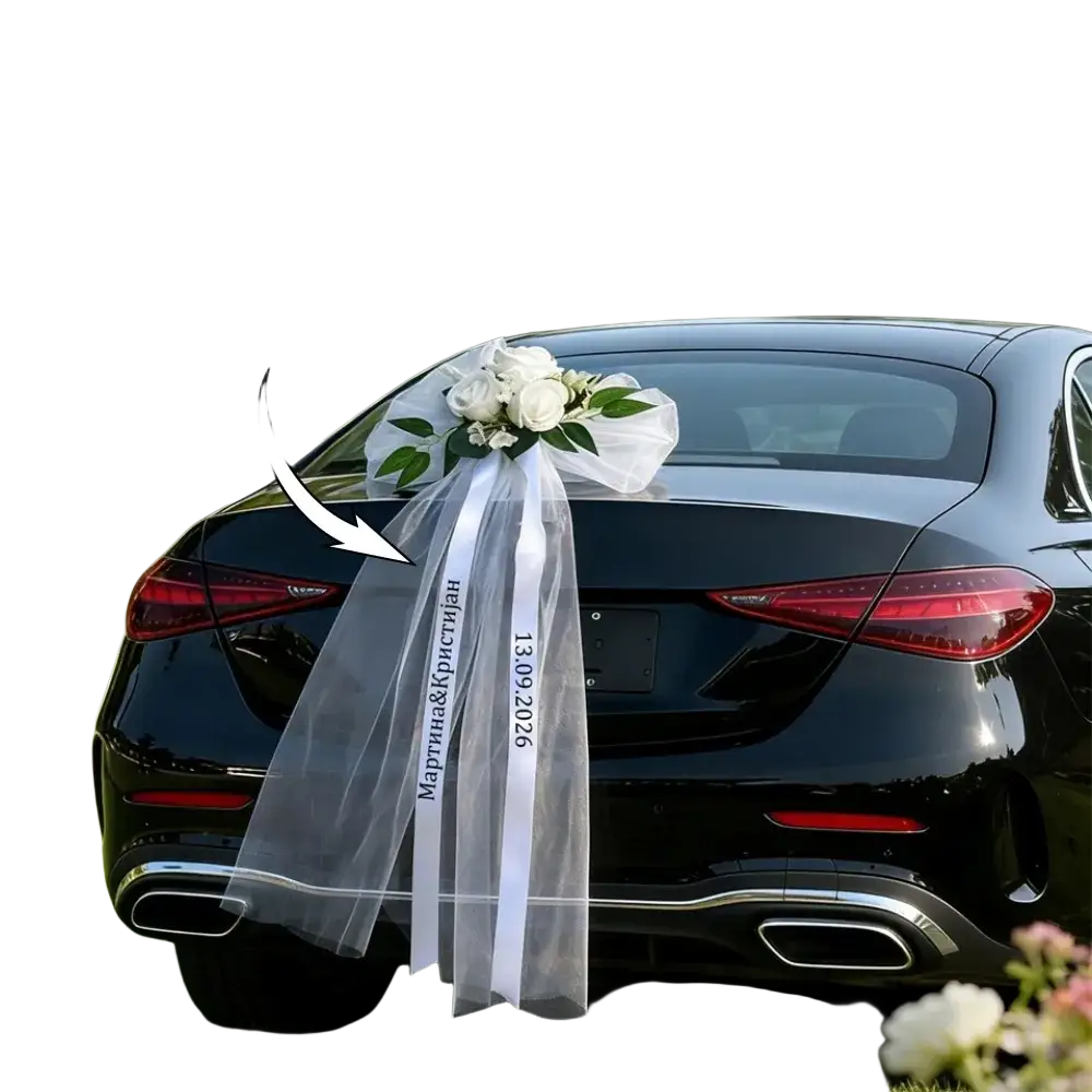 Custom wedding car floral garland and ribbon set featuring white sheer ribbon bow with embroidered names date and white roses bouquet