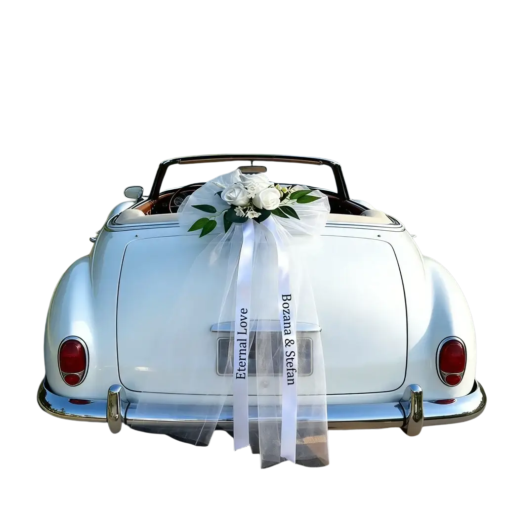 Back view of a white convertible car decorated with a custom wedding car floral garland and sheer ribbon set