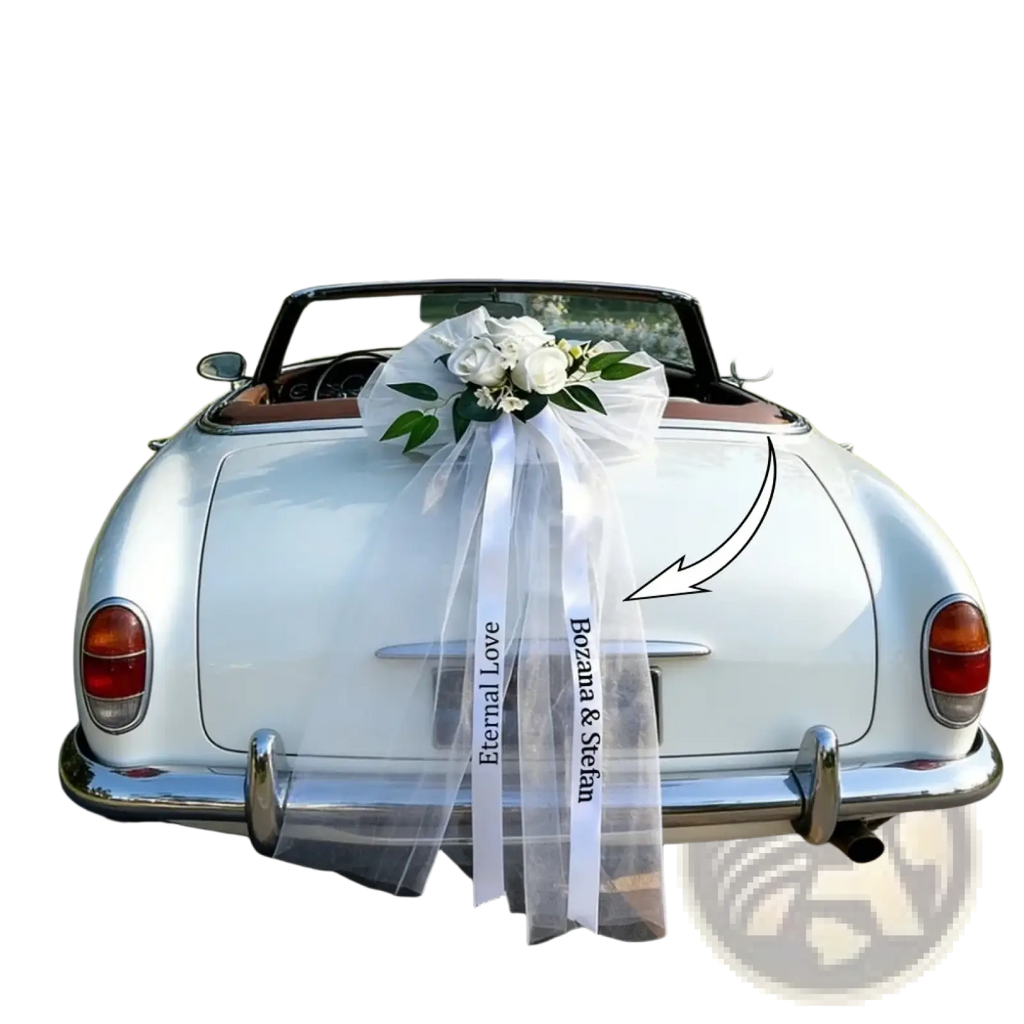 Custom wedding car floral garland and ribbon set with white satin ribbon bow and fresh white roses on convertible rear