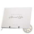 Custom wedding guest book with minimalist white hardcover elegant black cursive script and subtle ribbon bookmark