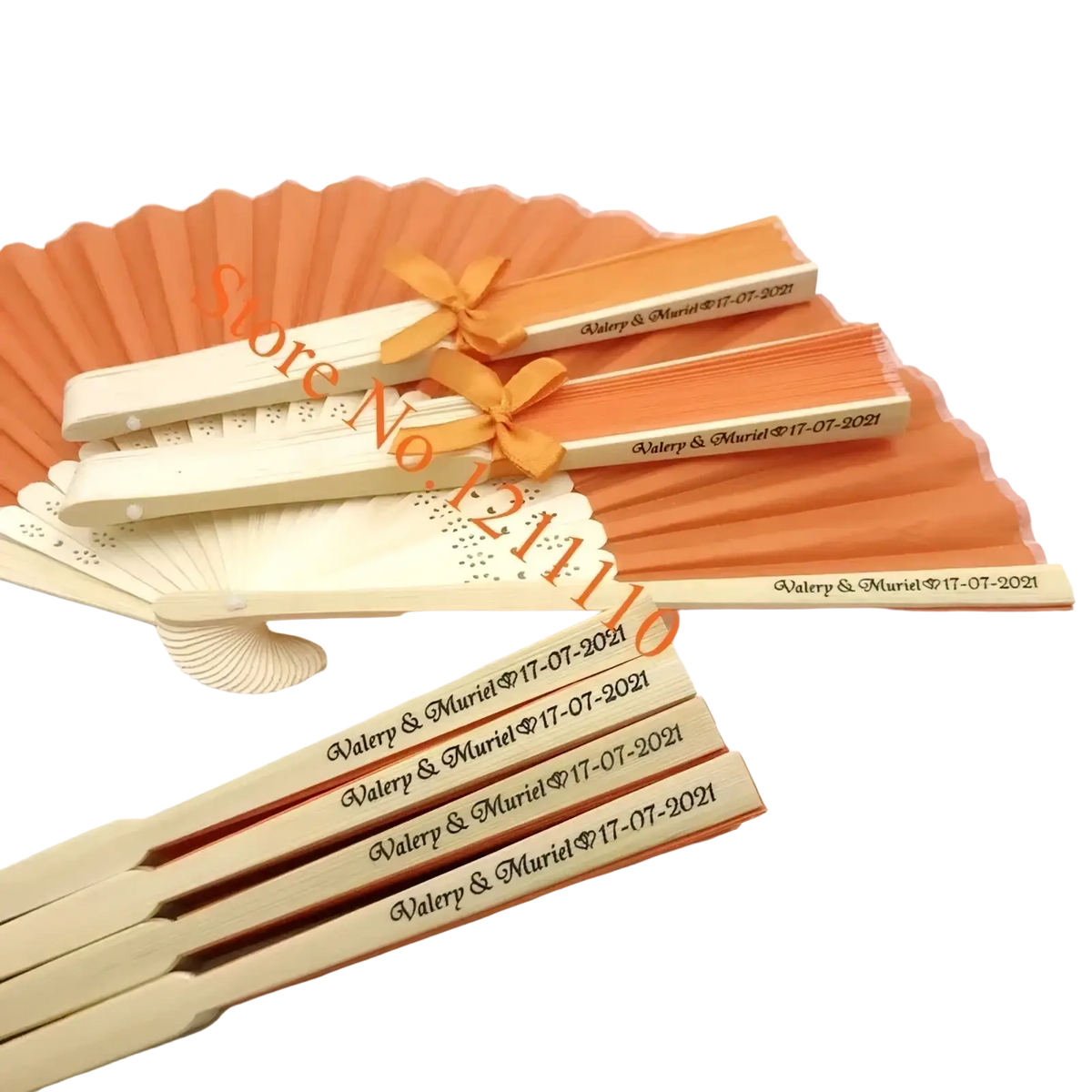 Custom wedding hand fans made of bamboo silk in orange and cream with engraved names and dates tied by an orange ribbon