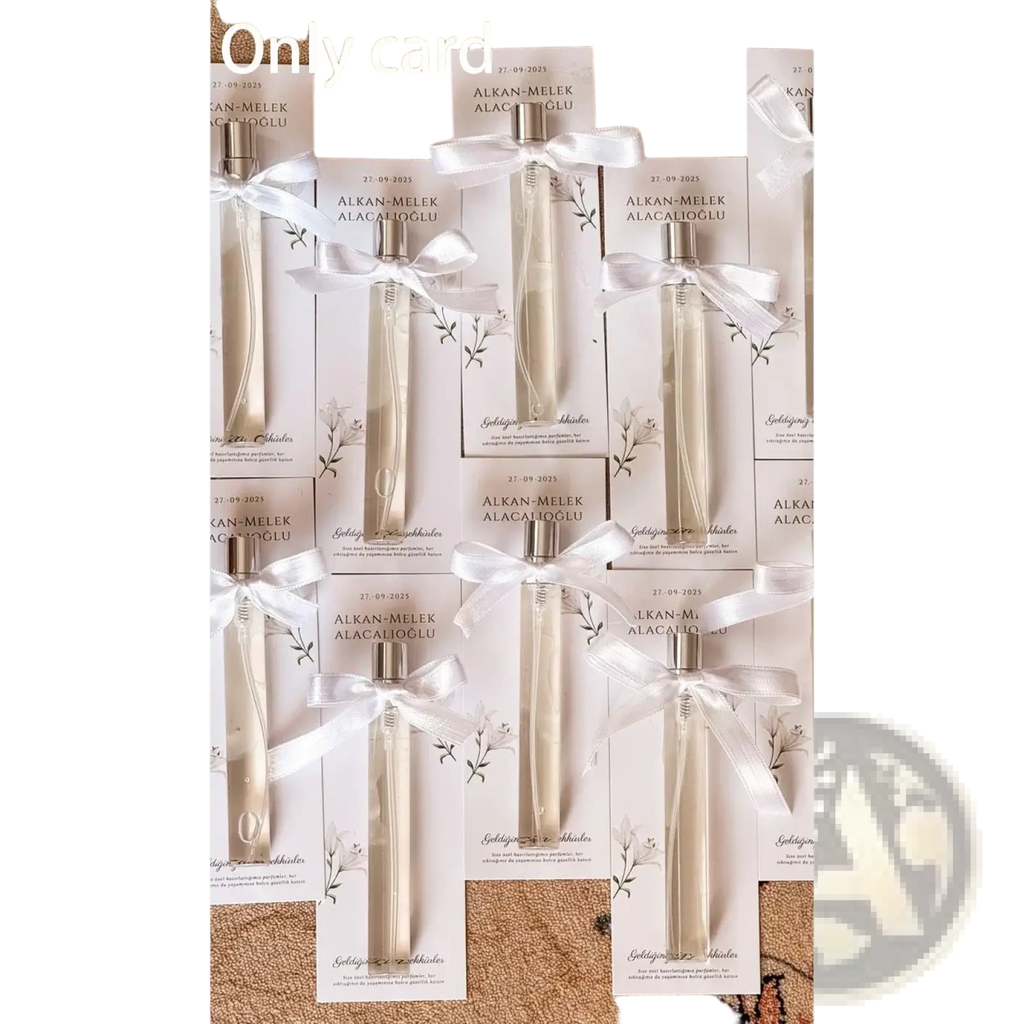 Elegant cream-colored glass diffuser bottles with silver caps in white cardboxes tied with satin ribbons for wedding favors