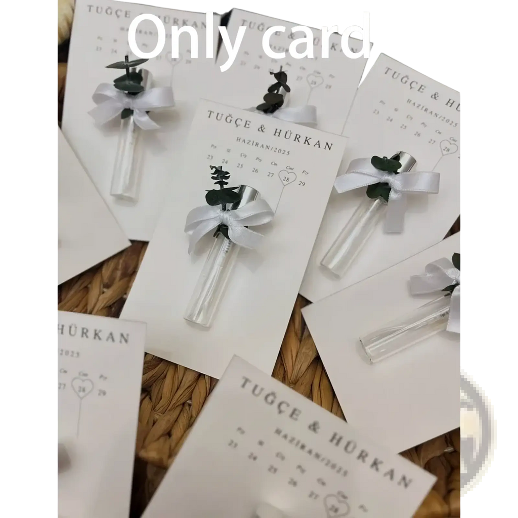Custom wedding perfume gift card featuring white paper calendar cards with clear glass vials and greenery accents