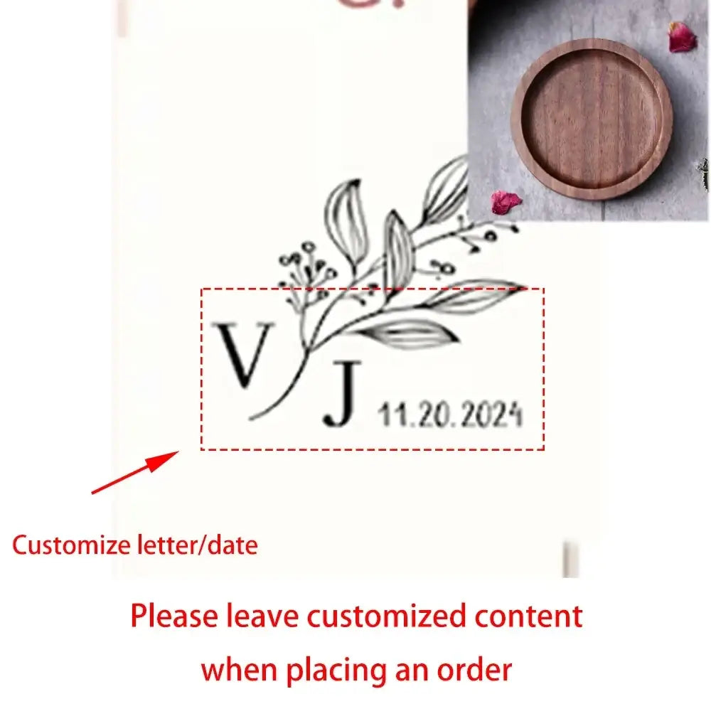 Custom wood ring dish engraved wedding ring holder with elegant black ink monogram and botanical leaf design on white background