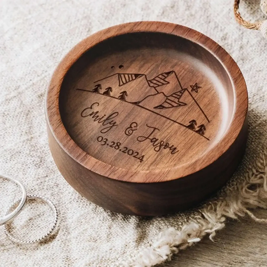 Custom wood ring dish engraved wedding ring holder in dark wood with laser-engraved mountain scene and personalized names