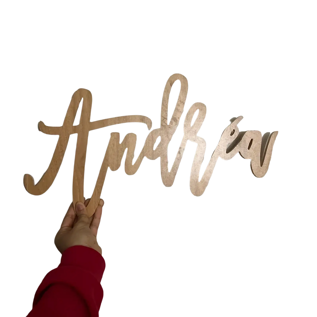 Custom wooden baby name sign in light-colored wood with the name Andrew in flowing cursive for nursery wall decor