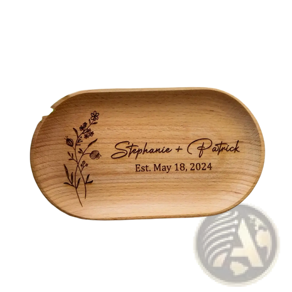 Light brown wooden oval tray engraved with floral design personalized with names stephanie and patrick and date est