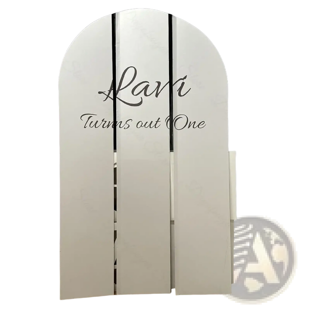 Customized white arched backdrop board with black cursive text for baby shower photo booth decoration