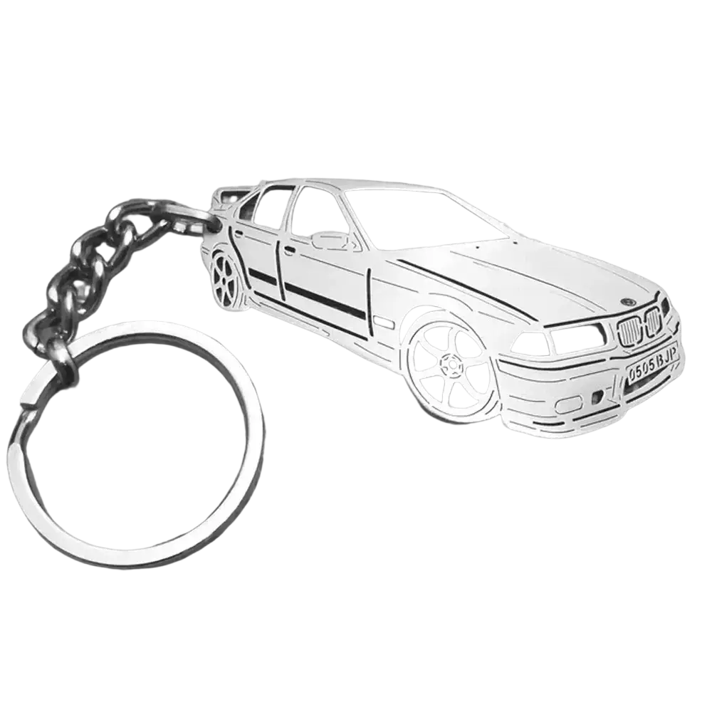 Customized silver metal keychain shaped like a BMW e36 sedan with detailed wheels and grille for car enthusiasts
