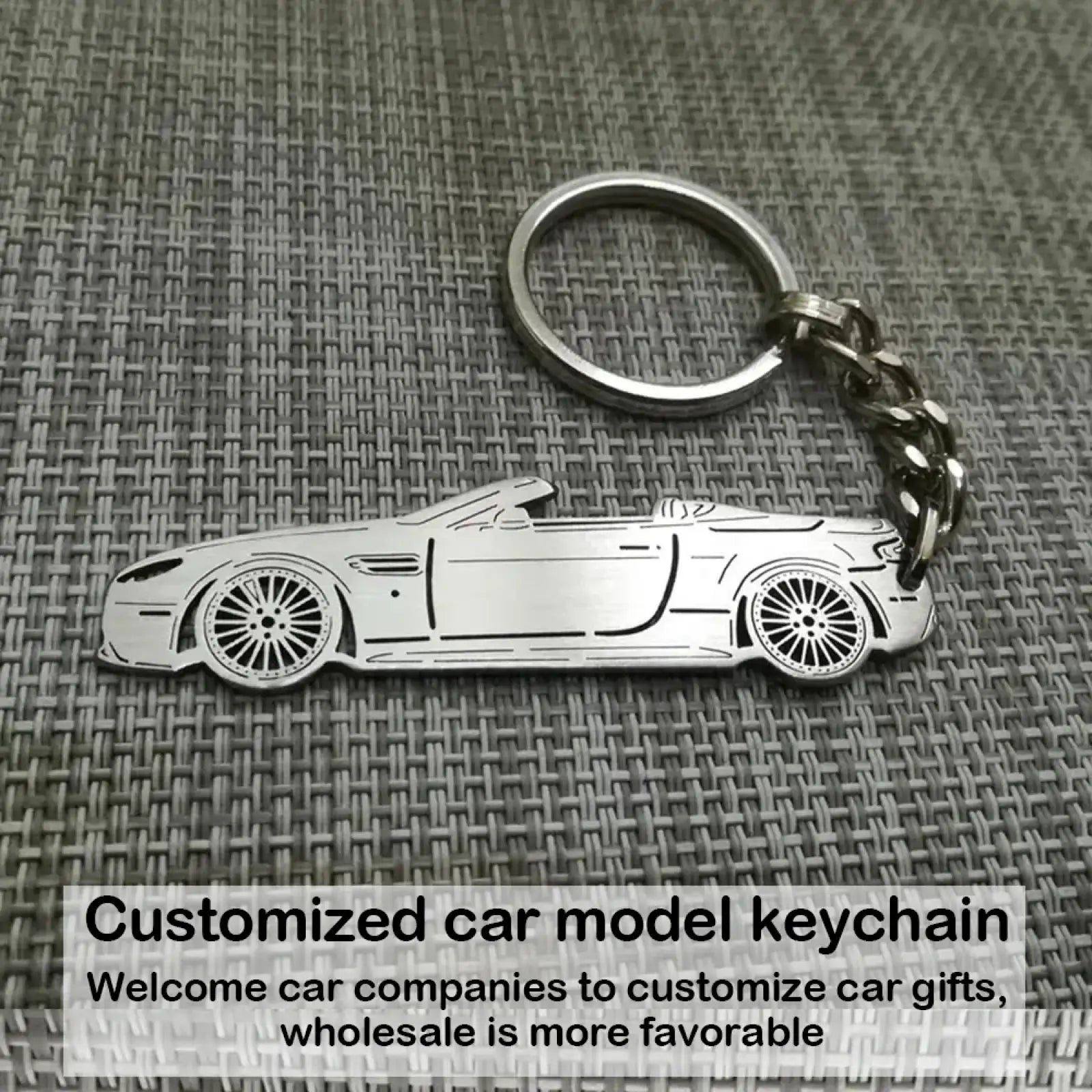 Silver metallic customized car model metal keychain shaped like a convertible sports car with detailed wheels and body lines