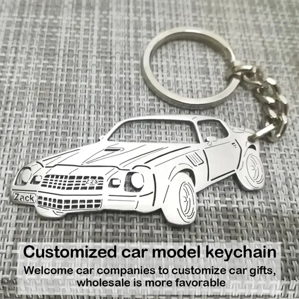 Silver metal customized car model keychain with zack and zzs engravings on the front for personalized use