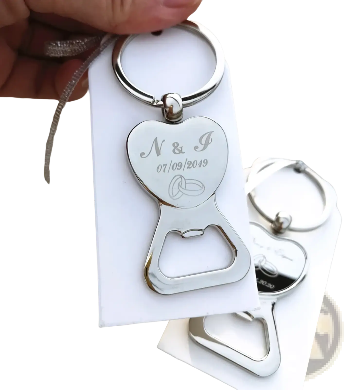 Silver heart-shaped metal bottle opener keychain with engraved initials and wedding date for customized wedding favors