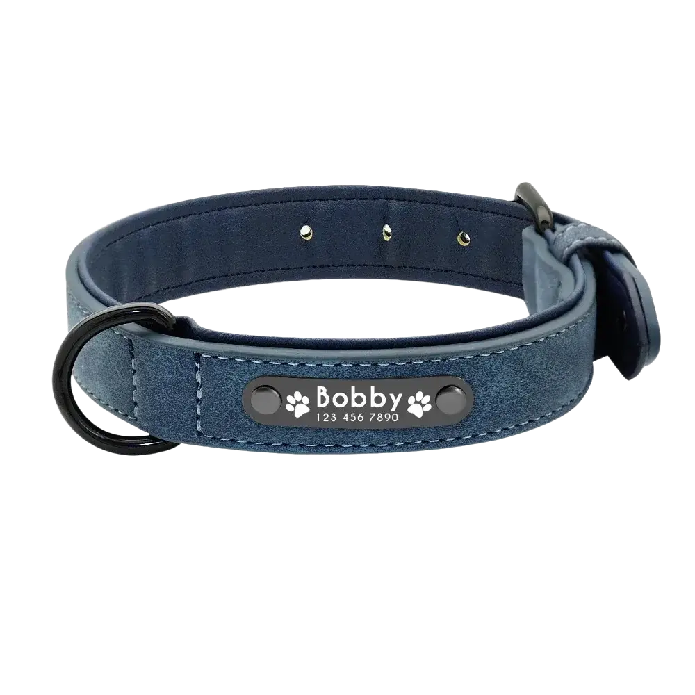 Navy blue faux leather dog collar with black metal buckle and customization information nameplate featuring bobby