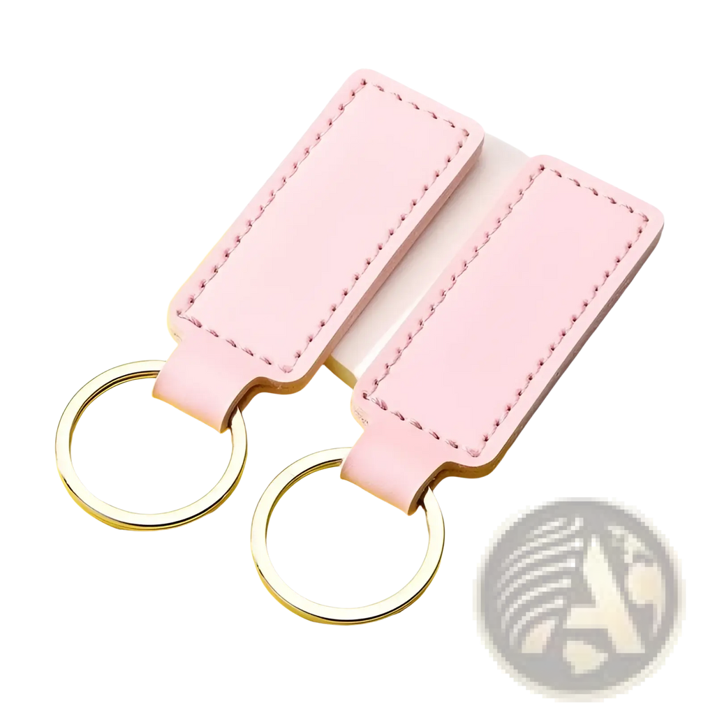 Pink rectangular leather keychains with silver toned metal rings in a customized leather keychain set
