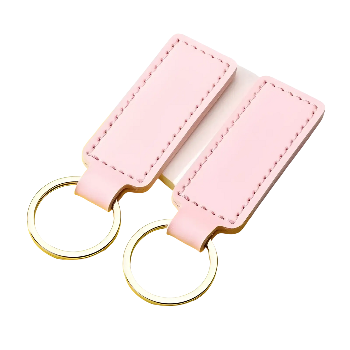 Pink rectangular leather keychains with silver toned metal rings in a customized leather keychain set