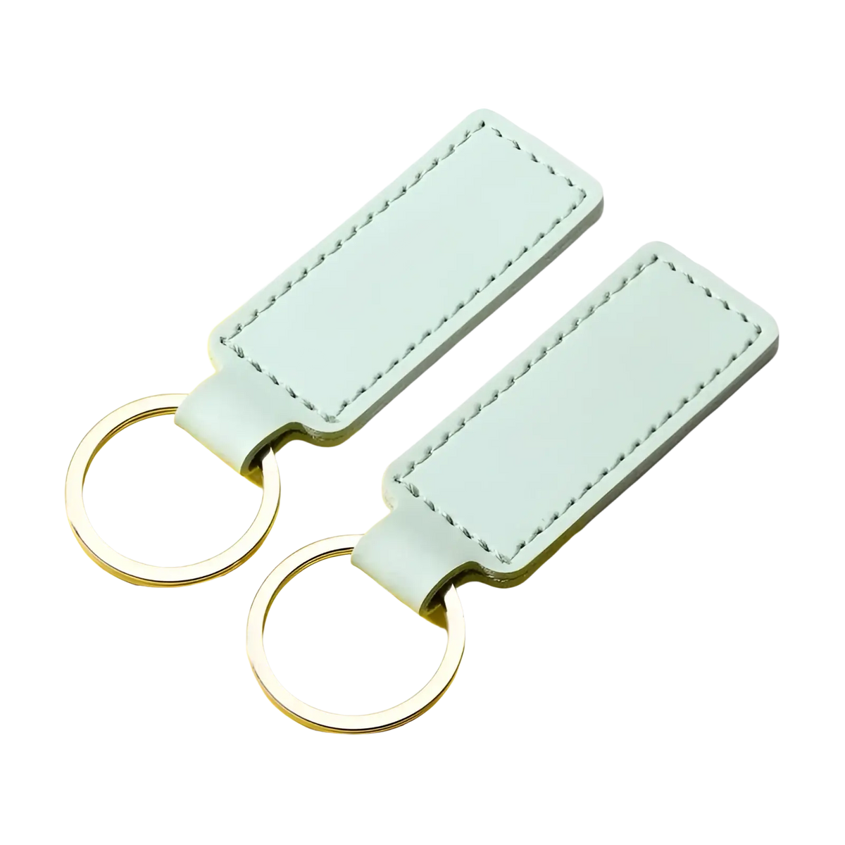 Two mint green customized leather keychains with silver-toned metal rings for personalized use