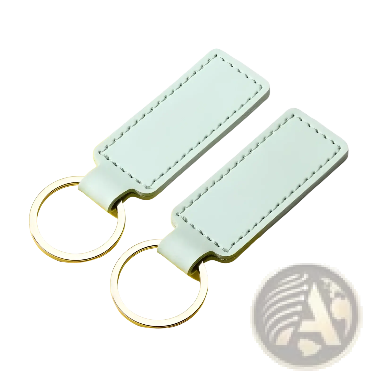 Two mint green customized leather keychains with silver-toned metal rings for personalized use