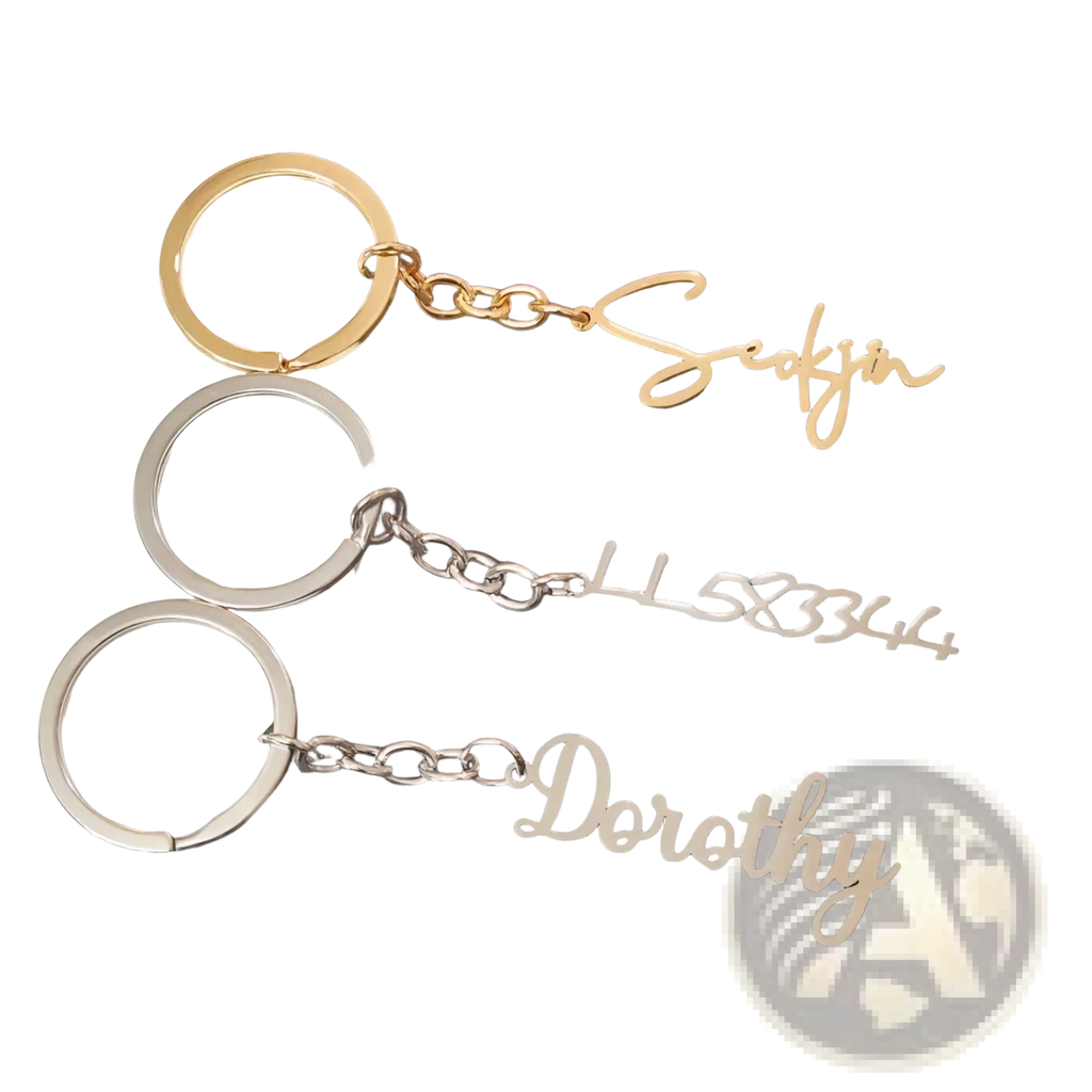 Customized name keychain set featuring gold and silver metal keychains with elegant cursive personalized lettering