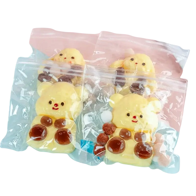 Yellow bear-shaped silicone phone case with brown circular accents and a smiling face for sensory fidget stress relief