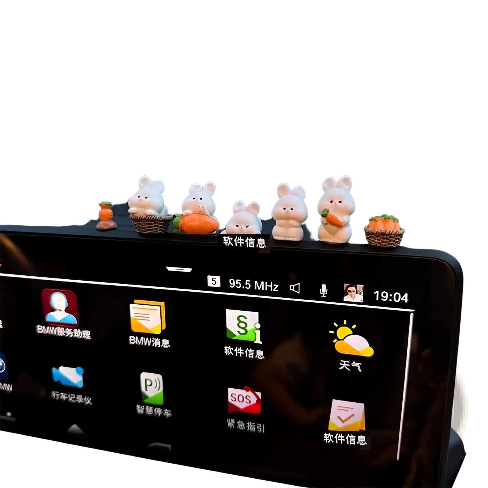 A row of five white cute bunny car dashboard ornaments with tiny baskets and carrots as decorations