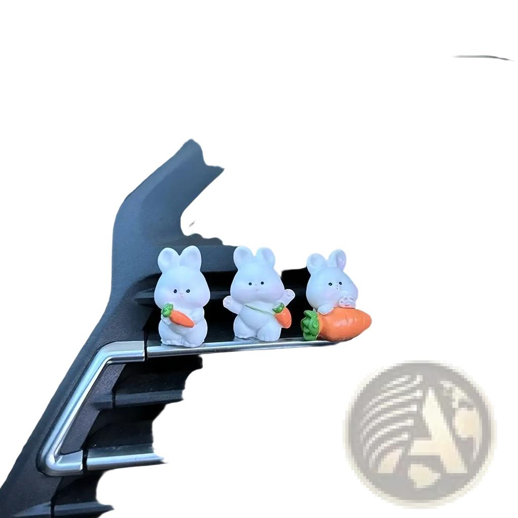 Three white plastic bunny figurines holding orange and green carrot ornaments for cute car dashboard decor