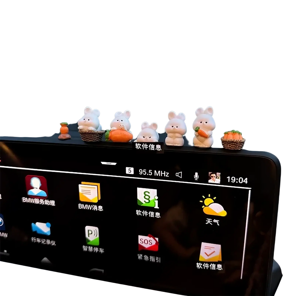 A row of five white cute bunny car dashboard ornaments with tiny baskets and carrots as decorations