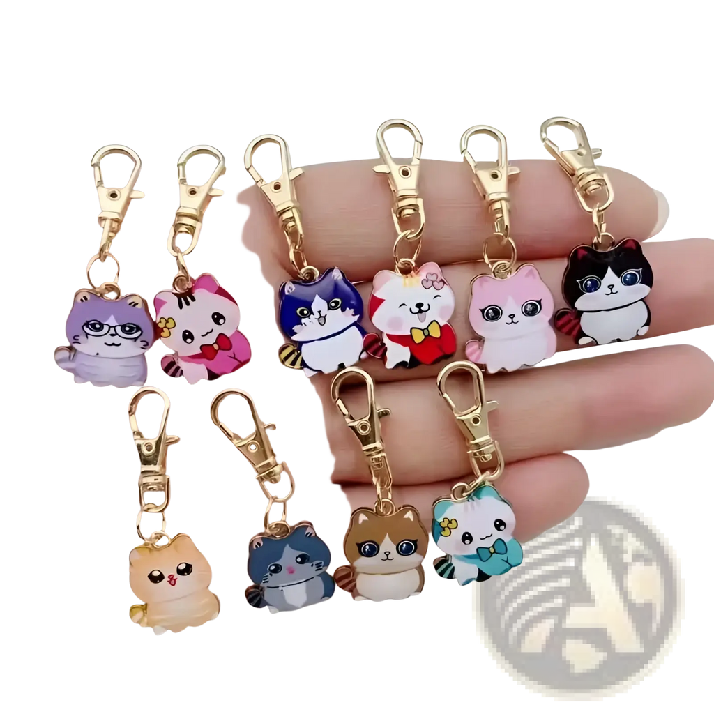 A collection of colorful cartoon-style cat keychains made of alloy with gold-toned clasps for decoration