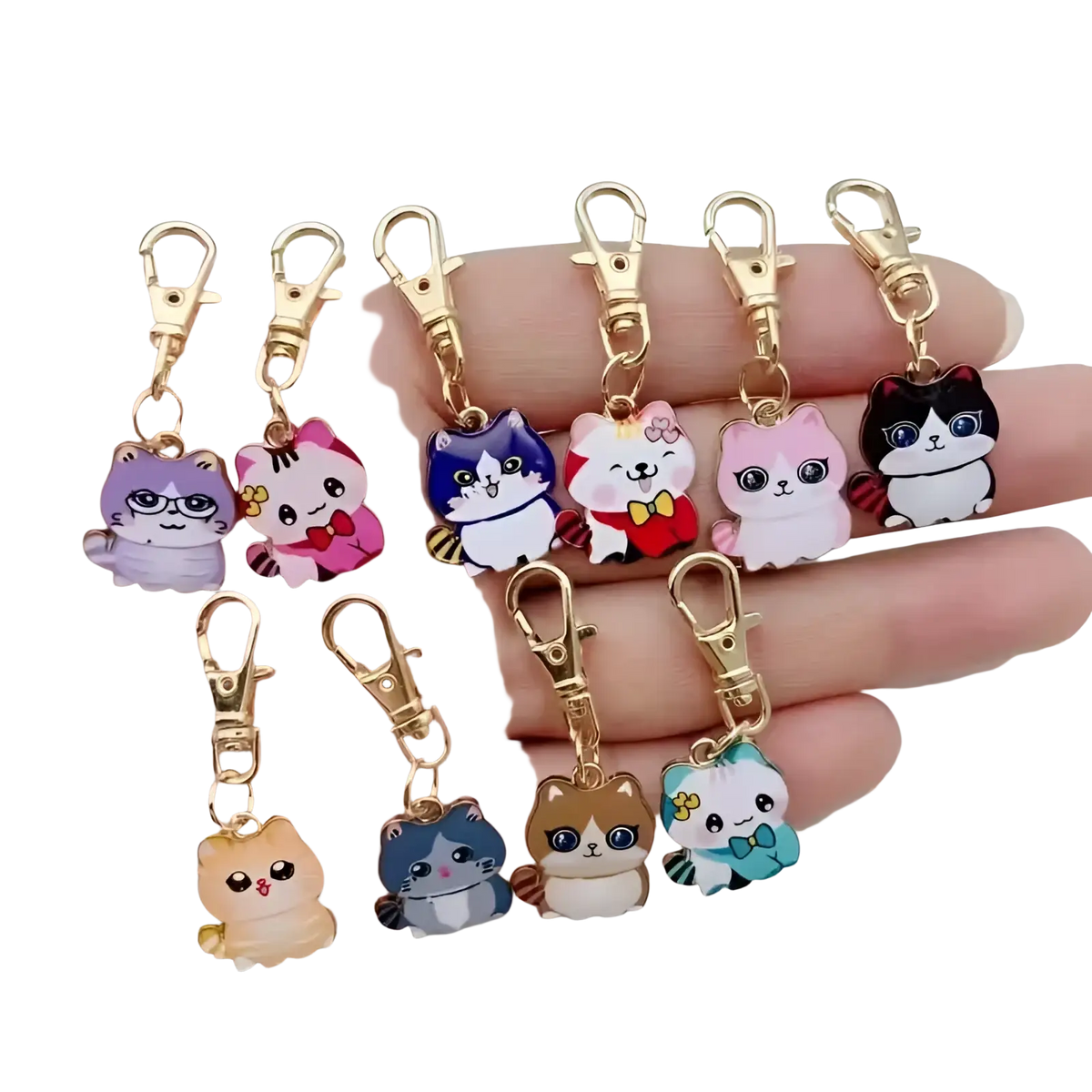 A collection of colorful cartoon-style cat keychains made of alloy with gold-toned clasps for decoration