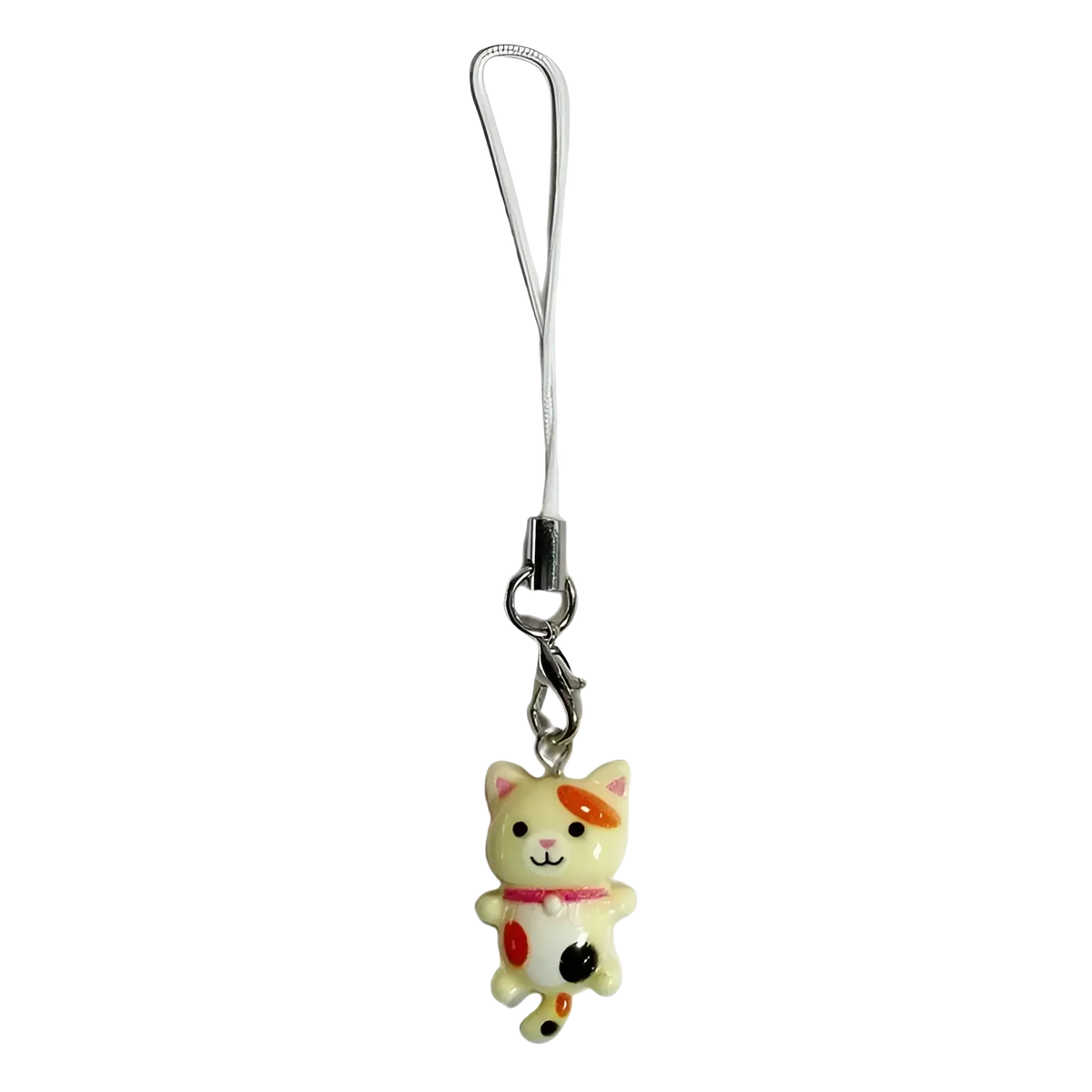 A cute cream-colored cat phone charm strap with orange and black spots wearing a red collar attached to a white cord