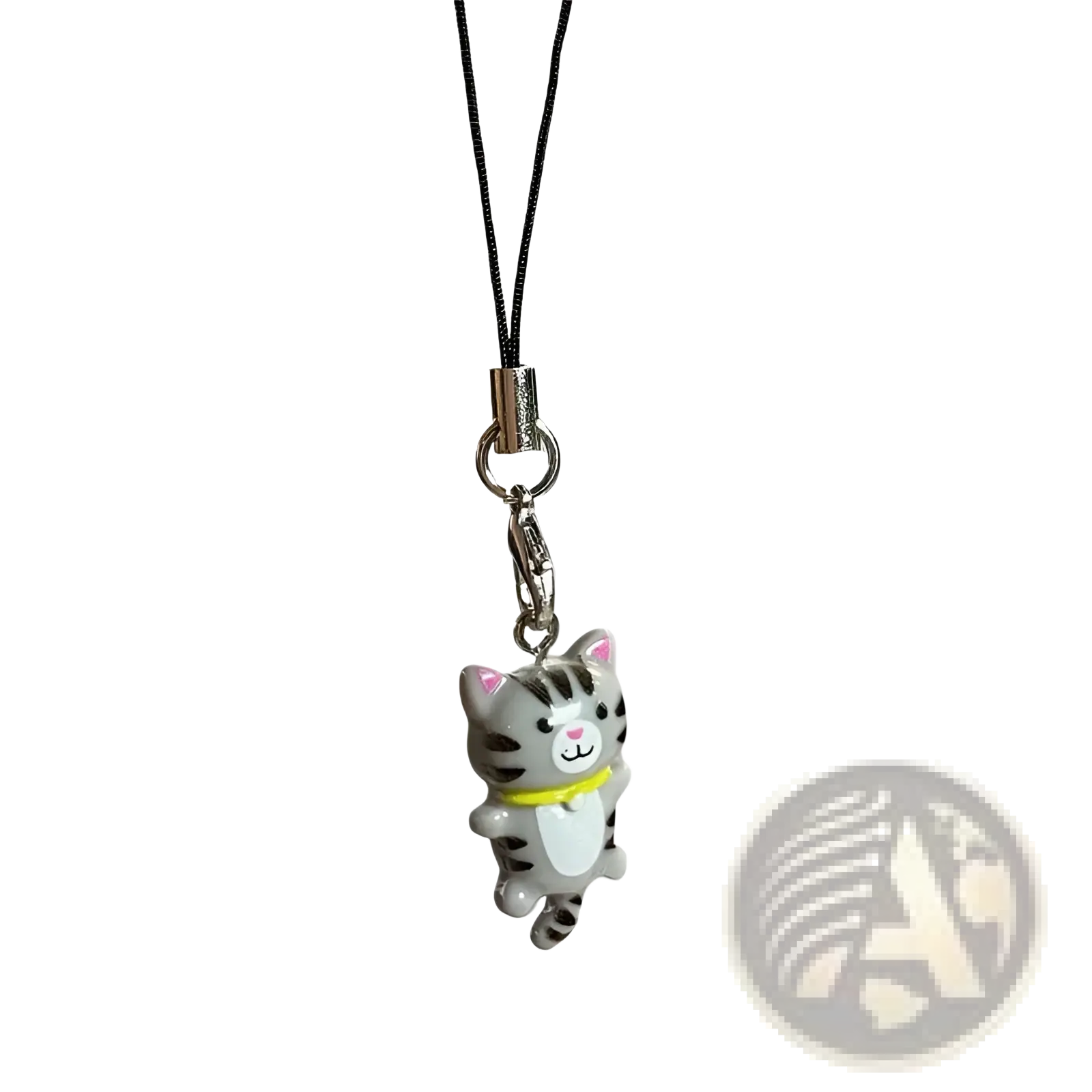 Cute cat phone charm strap featuring a gray tabby cat with pink ears and a yellow collar on a black cord