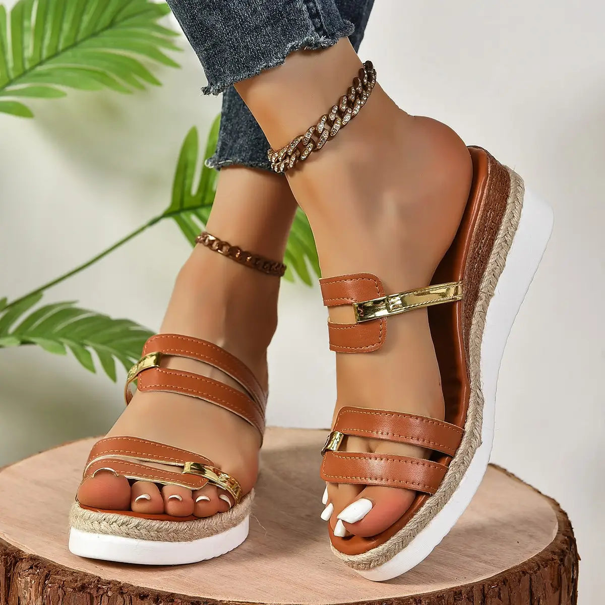 brown leather wedge sandals with espadrille heel and gold-tone metal accents featuring a woven sole