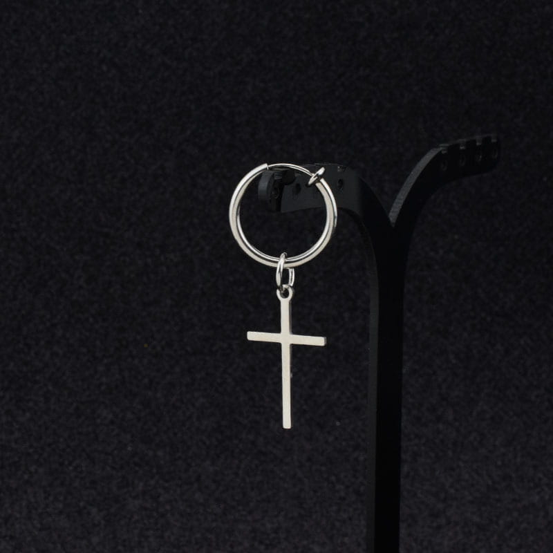 Minimalist stainless steel silver hoop earring with a dangling cross pendant.