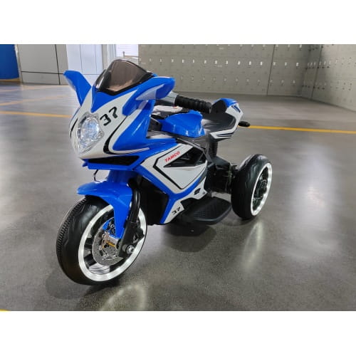 Blue and white 6v kids electric ride on motorcycle with black tires silver rims and number 37 on the front fairing.