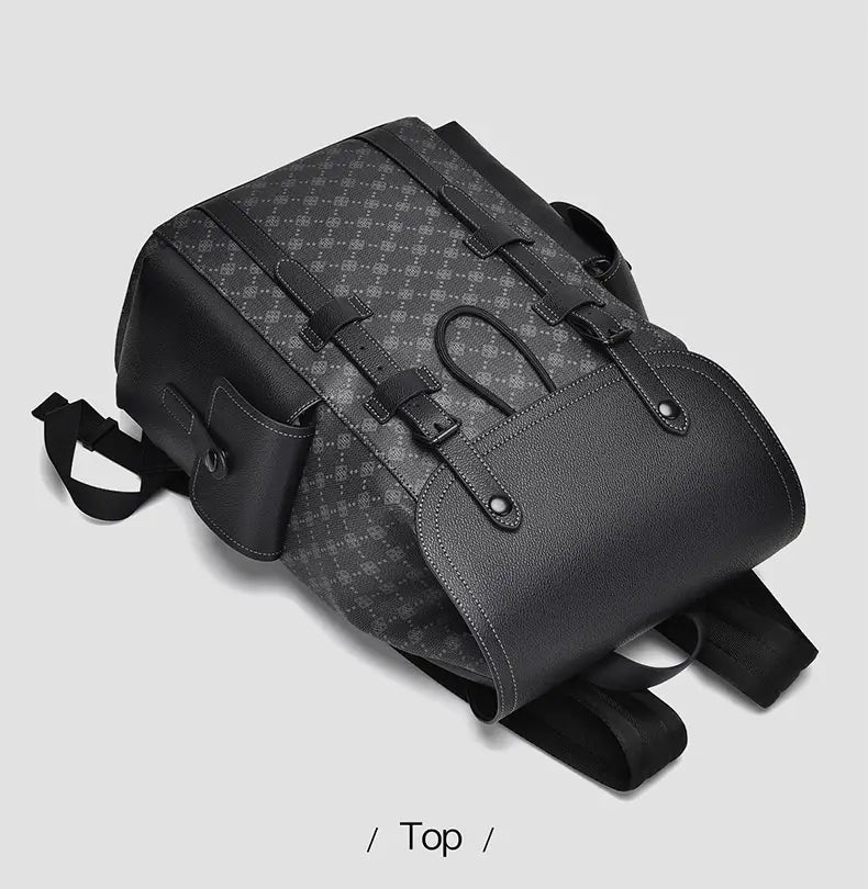 Men’s leather business travel backpack in black with a subtle gray geometric pattern, solid black straps, and top flap closure secured by two adjustable buckles featuring a laptop sleeve.