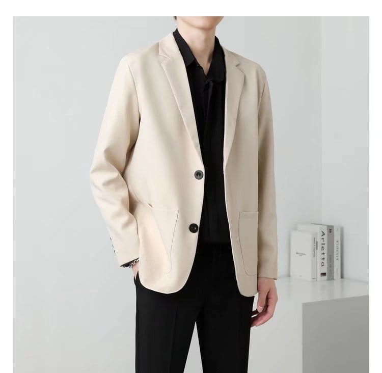 Men slim fit two button blazer in beige with black buttons featuring a sleek modern design.