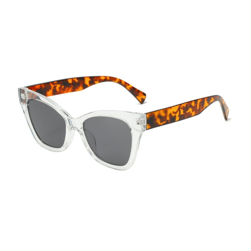 Gafas de sol de moda retro con forma de ojo de gato con montura de acetato transparente, brazos con patrón tipo carey, lentes gris oscuro y protección UV.