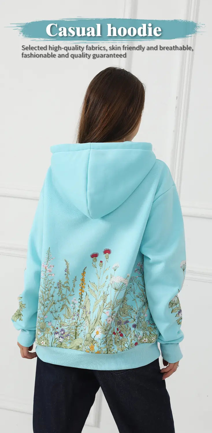 a light blue women’s casual hoodie made of soft fabric featuring detailed floral embroidery on the back and sleeves shown from the back side