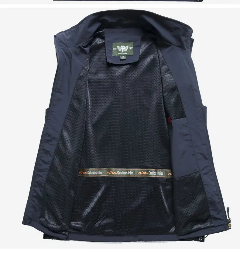 Men multi pocket fishing vest in dark navy waterproof material with mesh lining and branded tag at the collar.