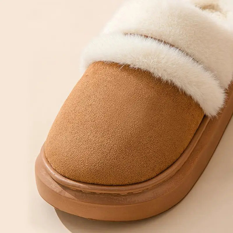 Tan suede slip-on mule with plush white faux fur lining designed as women’s plush suede thick sole winter house slippers.