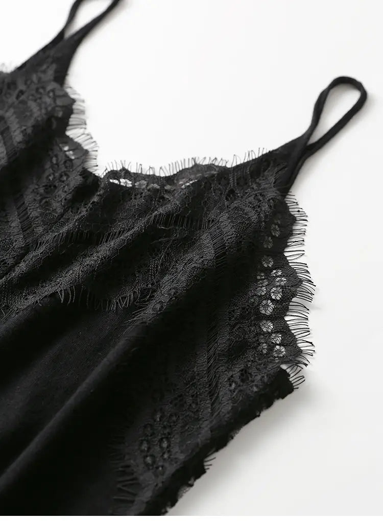 Black lace camisole top featuring delicate floral patterns and frayed edges in a sheer fabric.