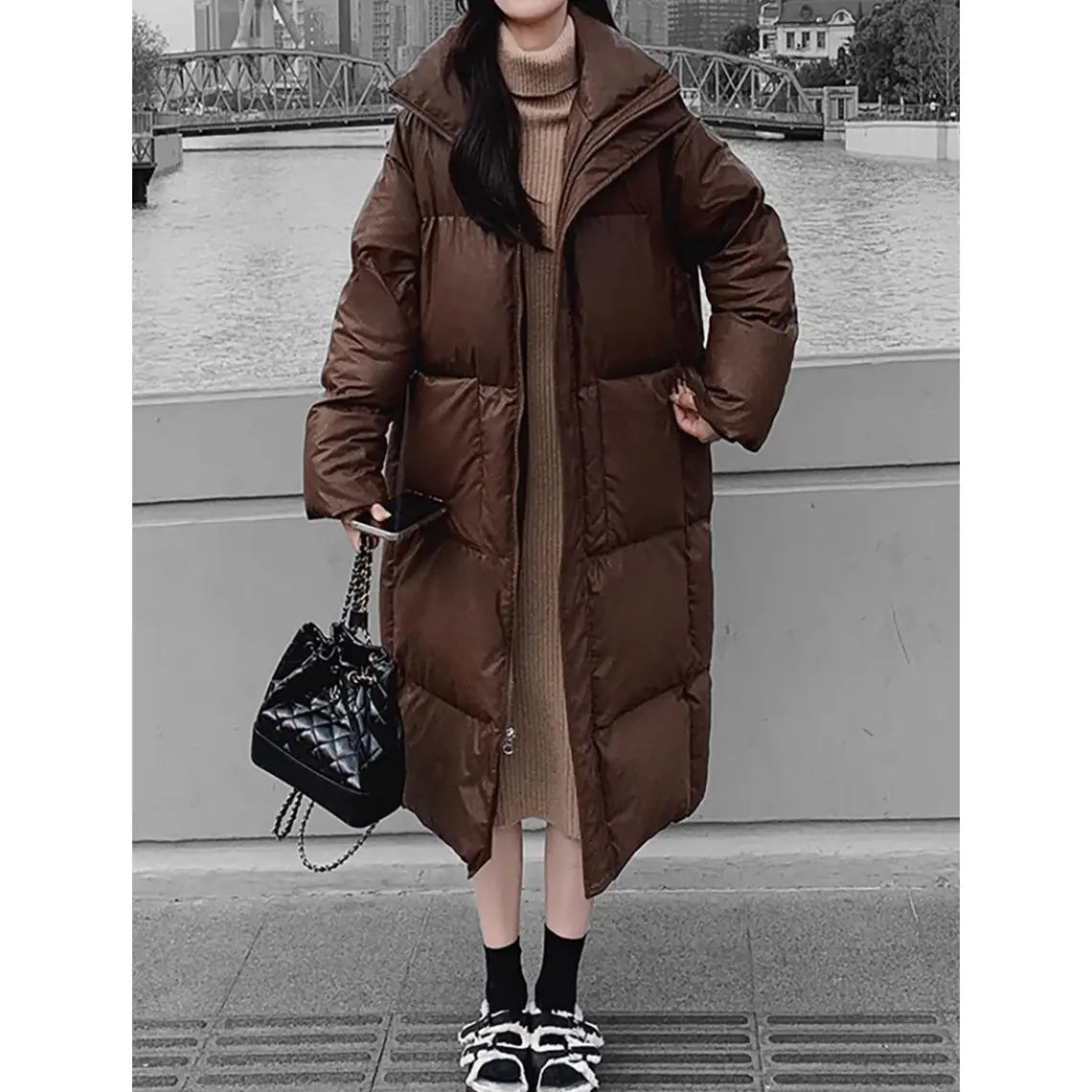 brown quilted puffer jacket mid length with a hood made of insulated material for warmth and style