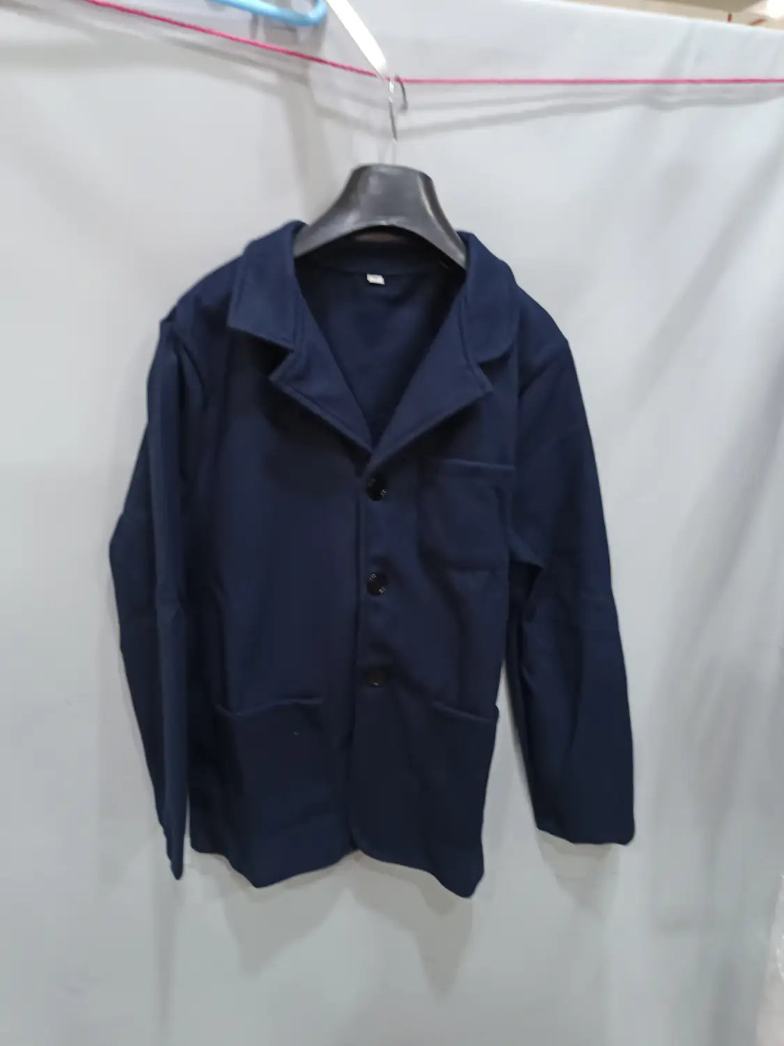 dark navy blue woolen slim blazer jacket for men featuring a classic collar and three black buttons