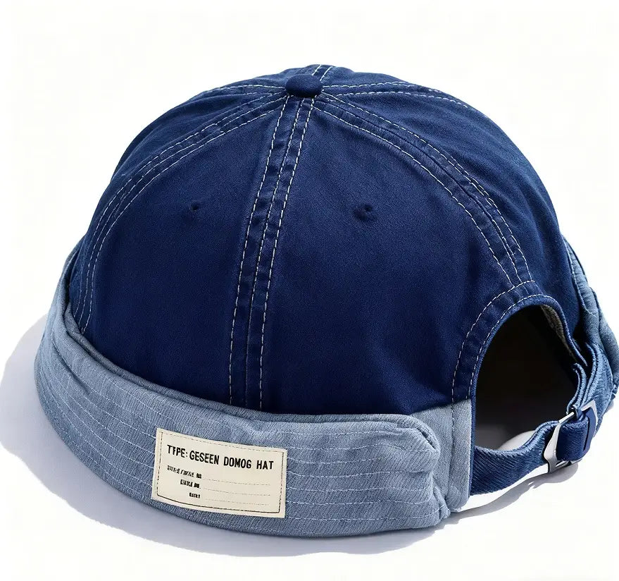 Canvas fedora hat for men featuring a navy blue denim cap with an adjustable denim strap and a contrasting light-wash denim brim with white stitching.