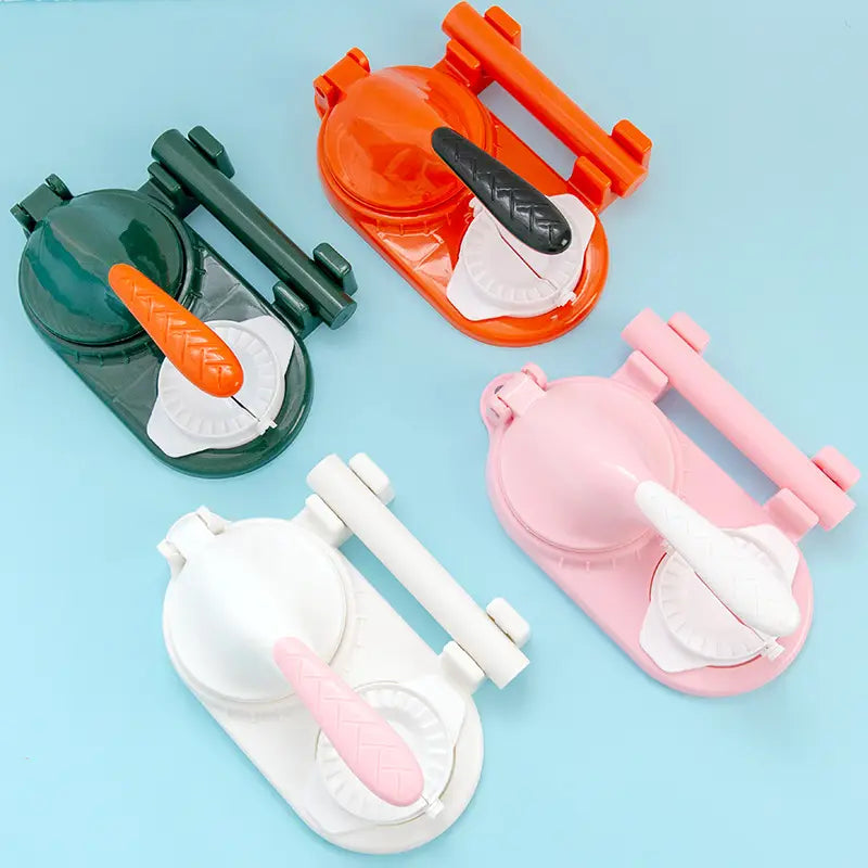 colorful plastic dumpling maker 3 in 1 manual dough pressing tool with ergonomic handles and decorative carrot-shaped grips.