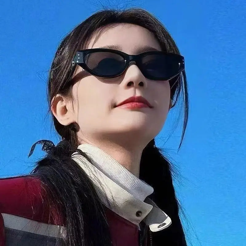 Black cat-eye uv400 sunglasses with glossy modern frames and dark lenses designed for retro style and UV protection.