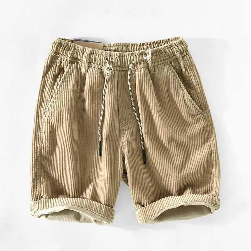 Beige men’s premium ribbed corduroy drawstring shorts with rolled cuffs and a comfortable waist for casual wear.
