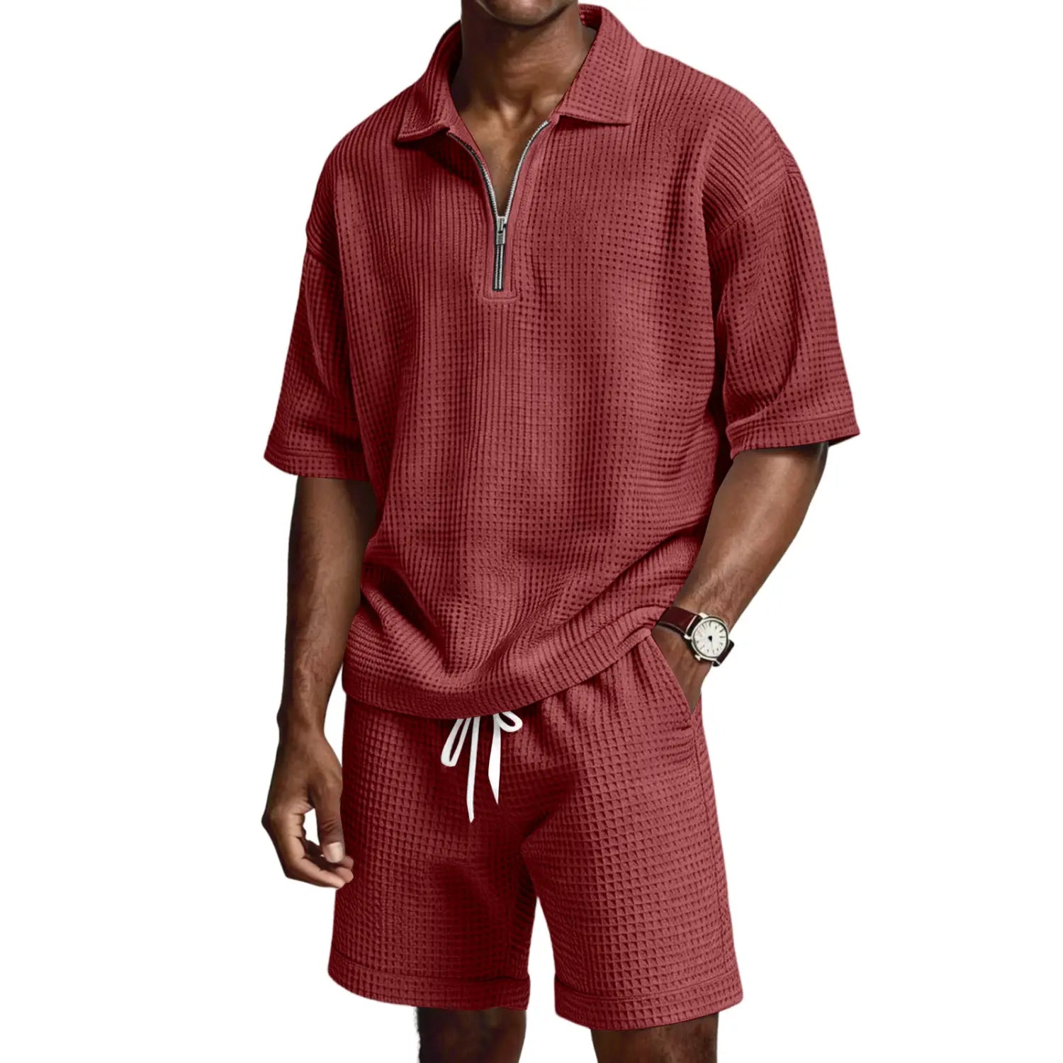 Chemise polo rouge en maille nid d’abeilles avec une ouverture à demi-zip et des manches courtes, issue de l’ensemble short polo à demi-zip en maille nid d’abeilles.