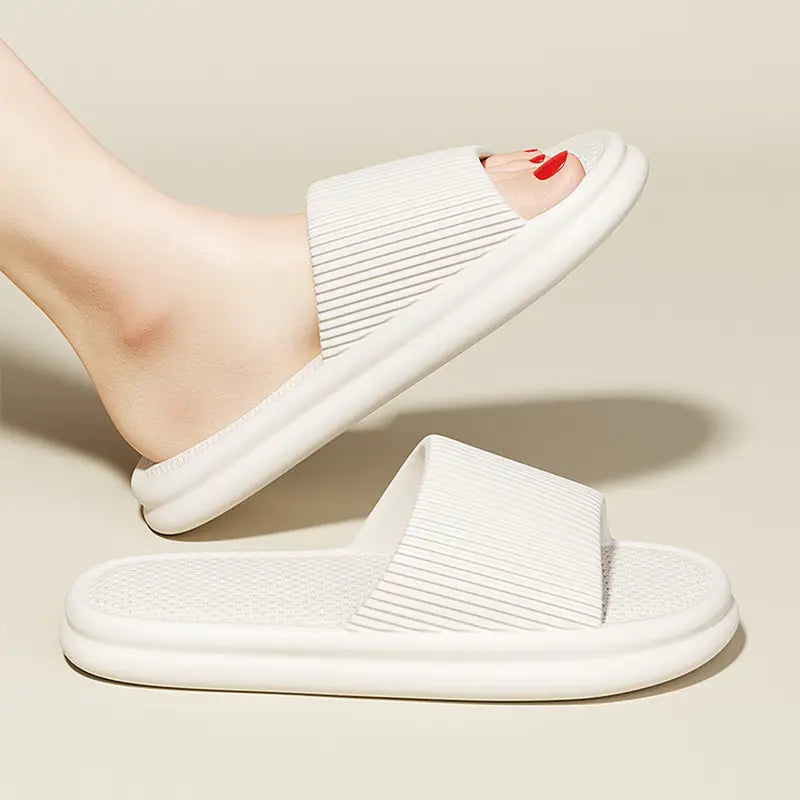 white ribbed unisex slide sandals made of eva with a soft cushioned sole designed for anti slip indoor use
