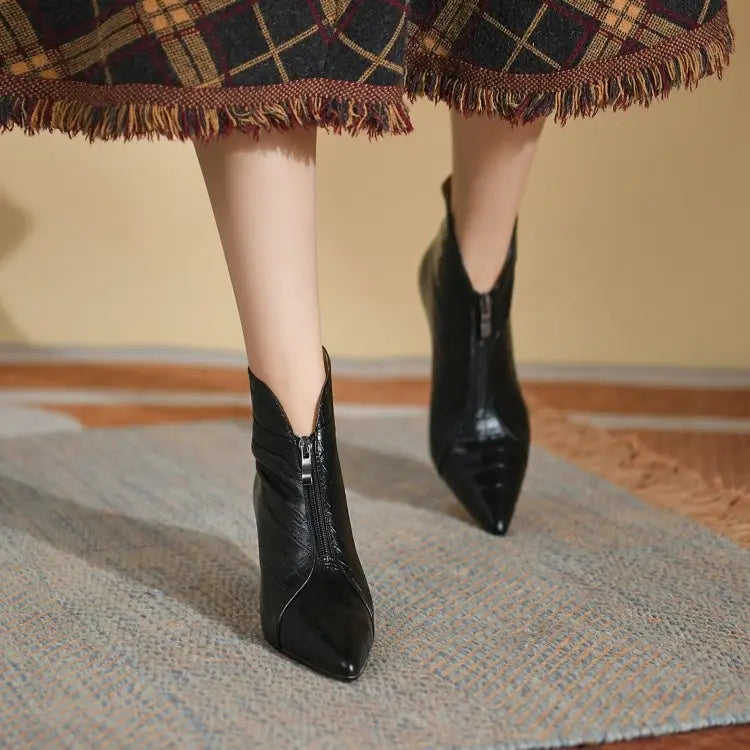 Black patent leather croc embossed stiletto ankle boots with a sharp pointed toe and side zipper.